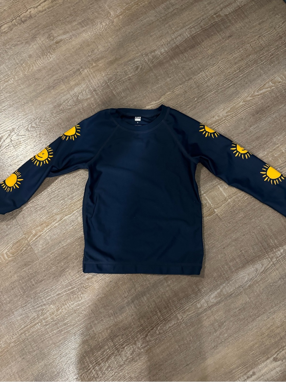 Tea Collection Navy Sun Sleeve Rash guard  - Yellow Suns on arms. Like new.